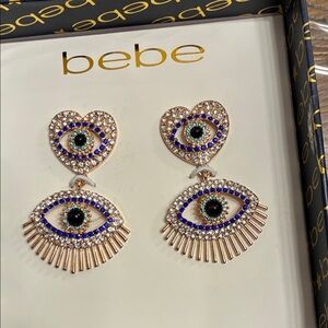 Bebe Heart and Eye Gold Earrings with Blue Accents